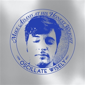 MIKE ADAMS AT HIS HONEST WEIGHT - OSCILLATE WISELY (10TH ANNIVERSARY EDITION) (MC) 149405
